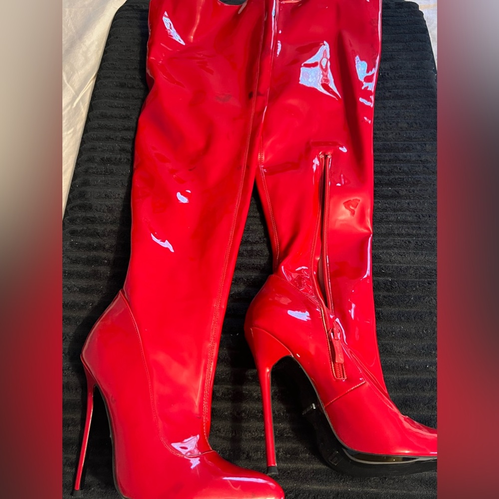 High boots, above the
knee.  red vinyl.